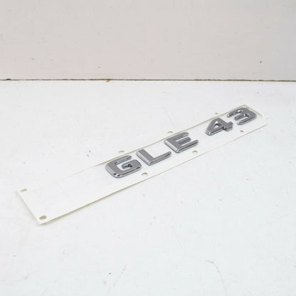 NEW MB GLE W166 REAR TRUNK BOOTLID EMBLEM BADGE A1668176400