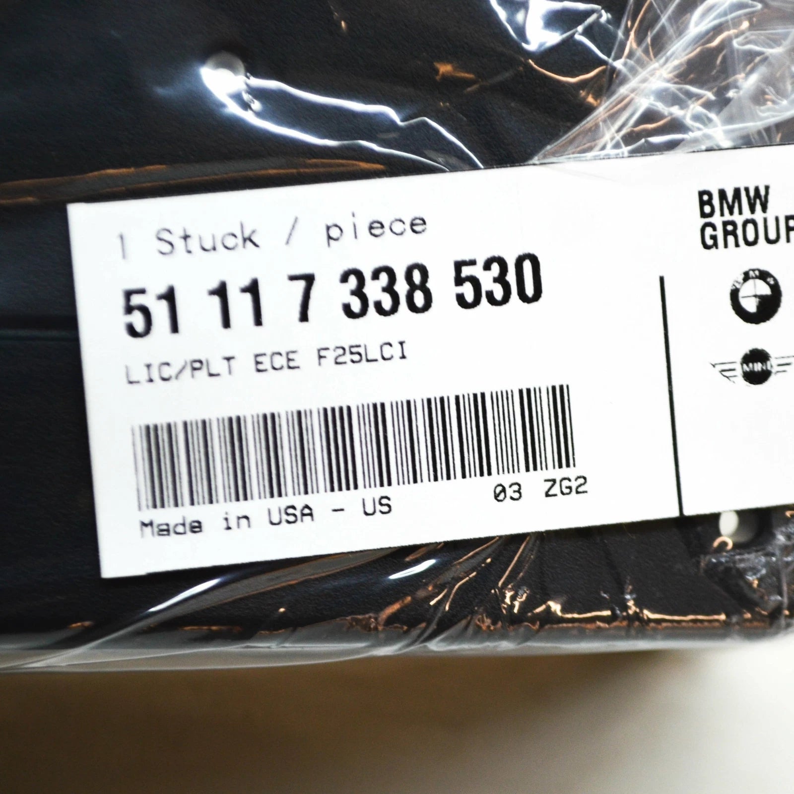 NEW BMW X3 F25 FRONT BUMPER LICENSE NUMBER PLATE HOLDER ECE 51117338530 ORIGINAL