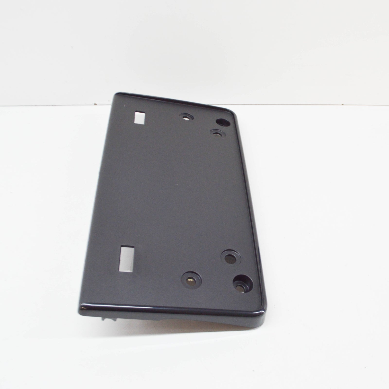 NEW VW TOUAREG 7P FRONT LICENSE PLATE HOLDER 7P6807287F ORIGINAL