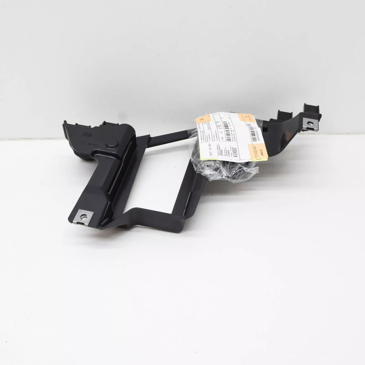 NEW BMW X5 E53 FRONT LEFT HEADLIGHT BRACKET 63126927797 6927797 ORIGINAL