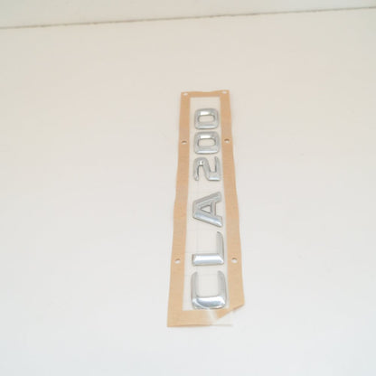 NEW MERCEDES BENZ CLA C117 REAR TRUNK BADGE EMBLEM 	A1178171015 ORIGINAL