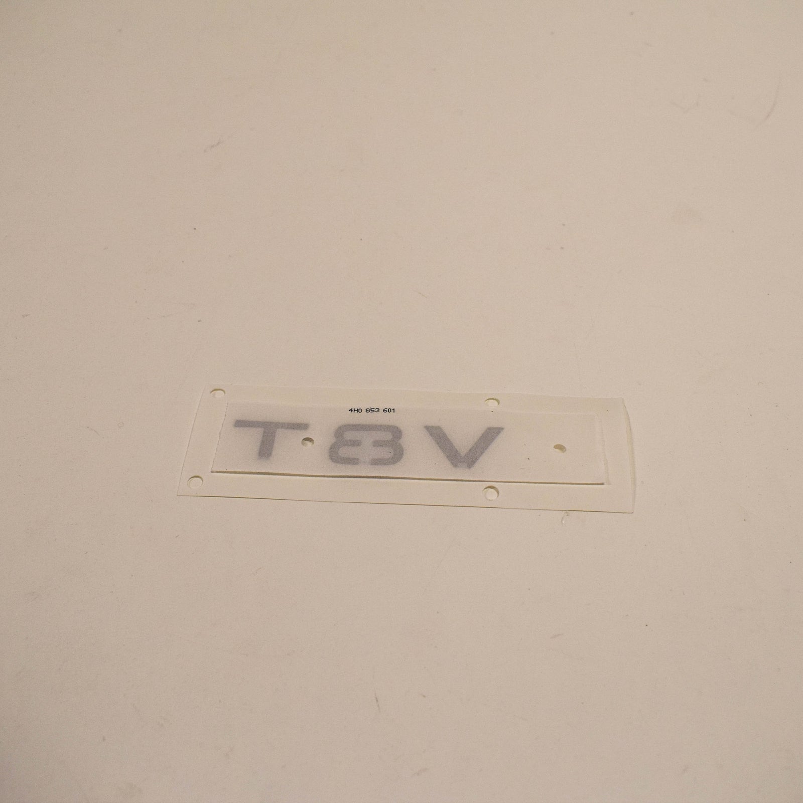 NEW AUDI A8 4H FRONT BUMPER SIDE EMBLEM INSCRIPTION BADGE 4H0853601 2ZZ ORIGINAL