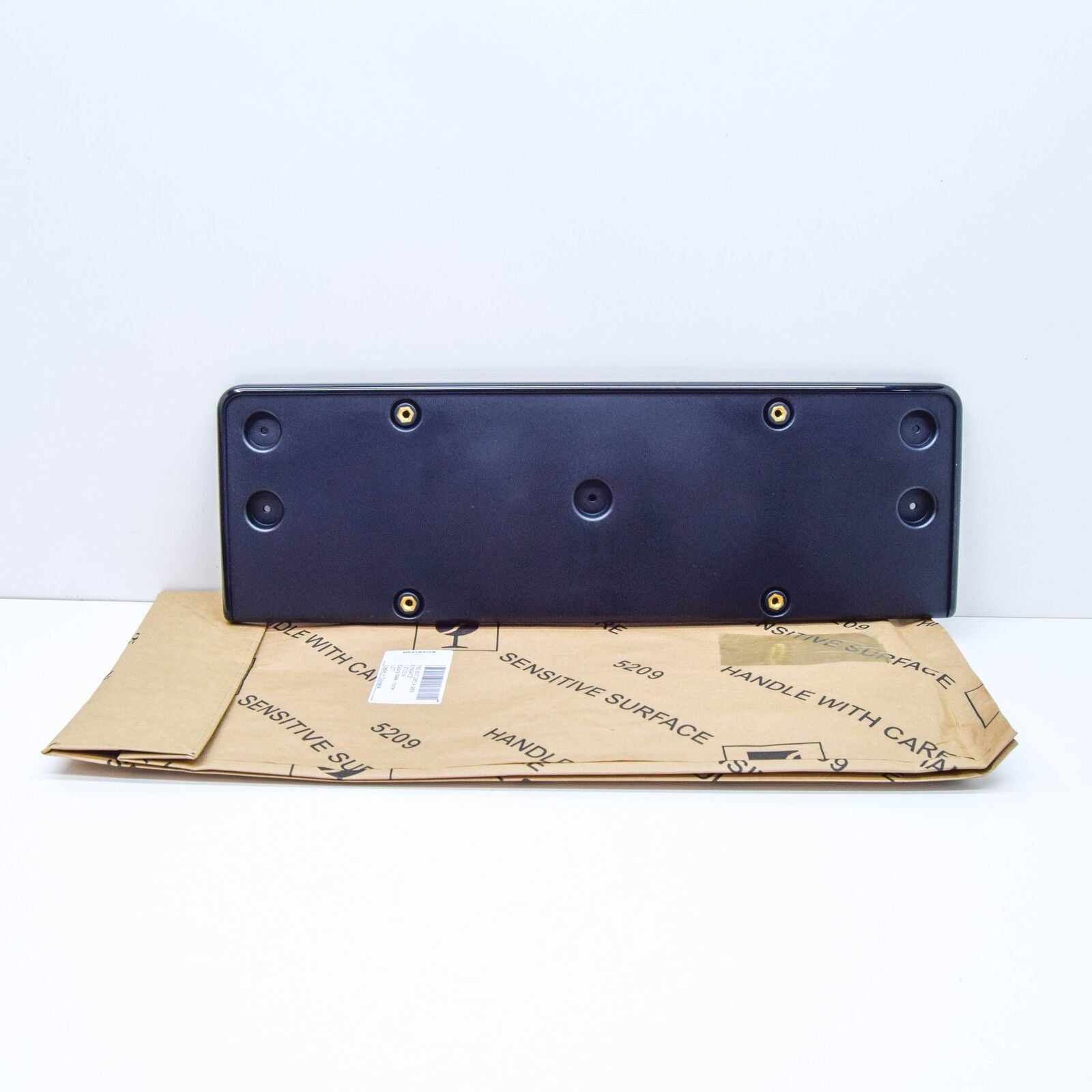 NEW VW TOUAREG CR FRONT LICENSE PLATE HOLDER 760807285A9B9 ORIGINAL