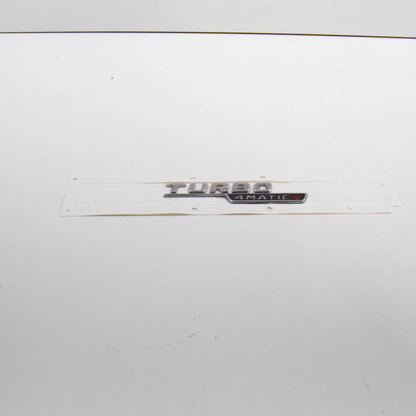 NEW MB E W213 FRONT FENDER WING LEFT EMBLEM BADGE 4MATIC A2908172300 ORIGINAL