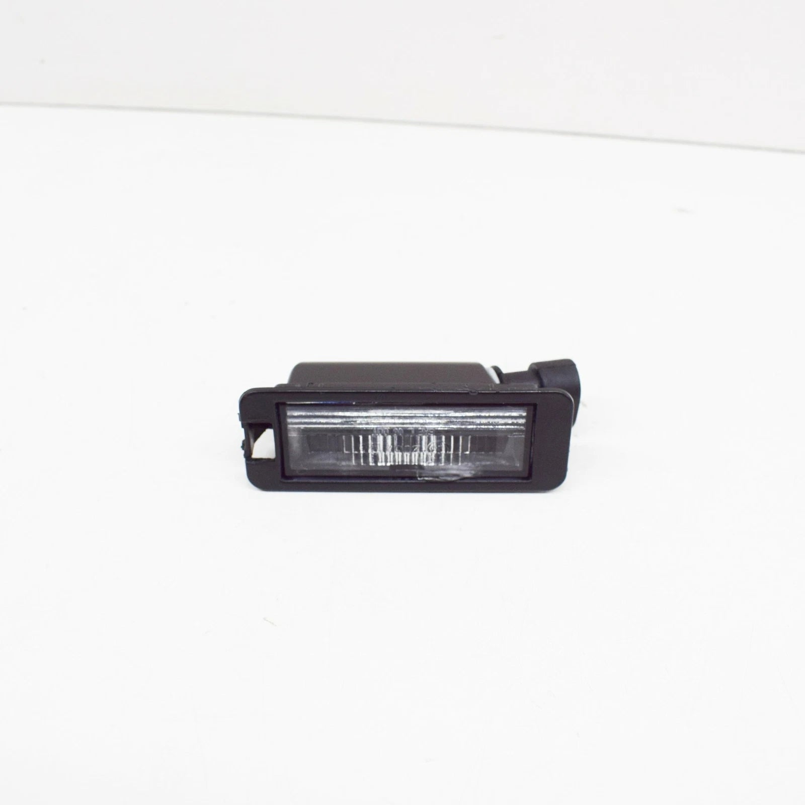 NEW VOLKSWAGEN FOX LICENSE PLATE LIGHT 1JE943021A ORIGINAL