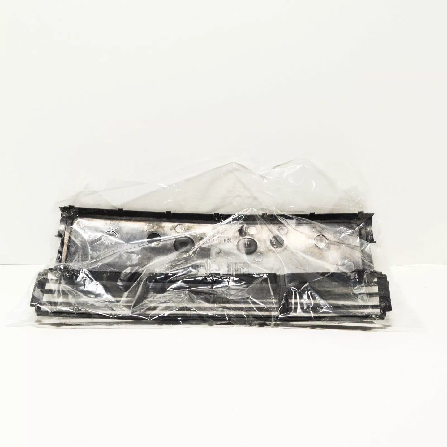 NEW BMW 5 SERIES E34 LICENSE PLATE GRID HOLDER 1934337 51111934337 ORIGINAL