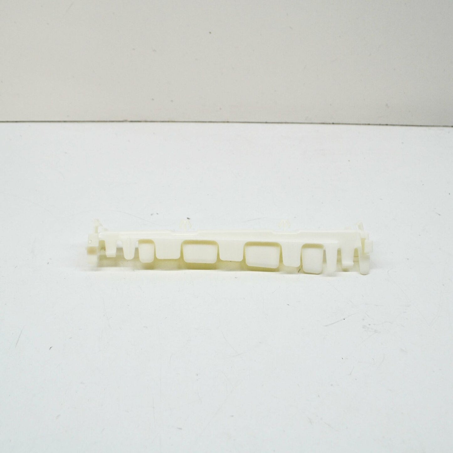 NEW MB E COUPE C207 FRONT RIGHT SIDE PLASTIC SKIRT HOLDER A2076980127 ORIGINAL