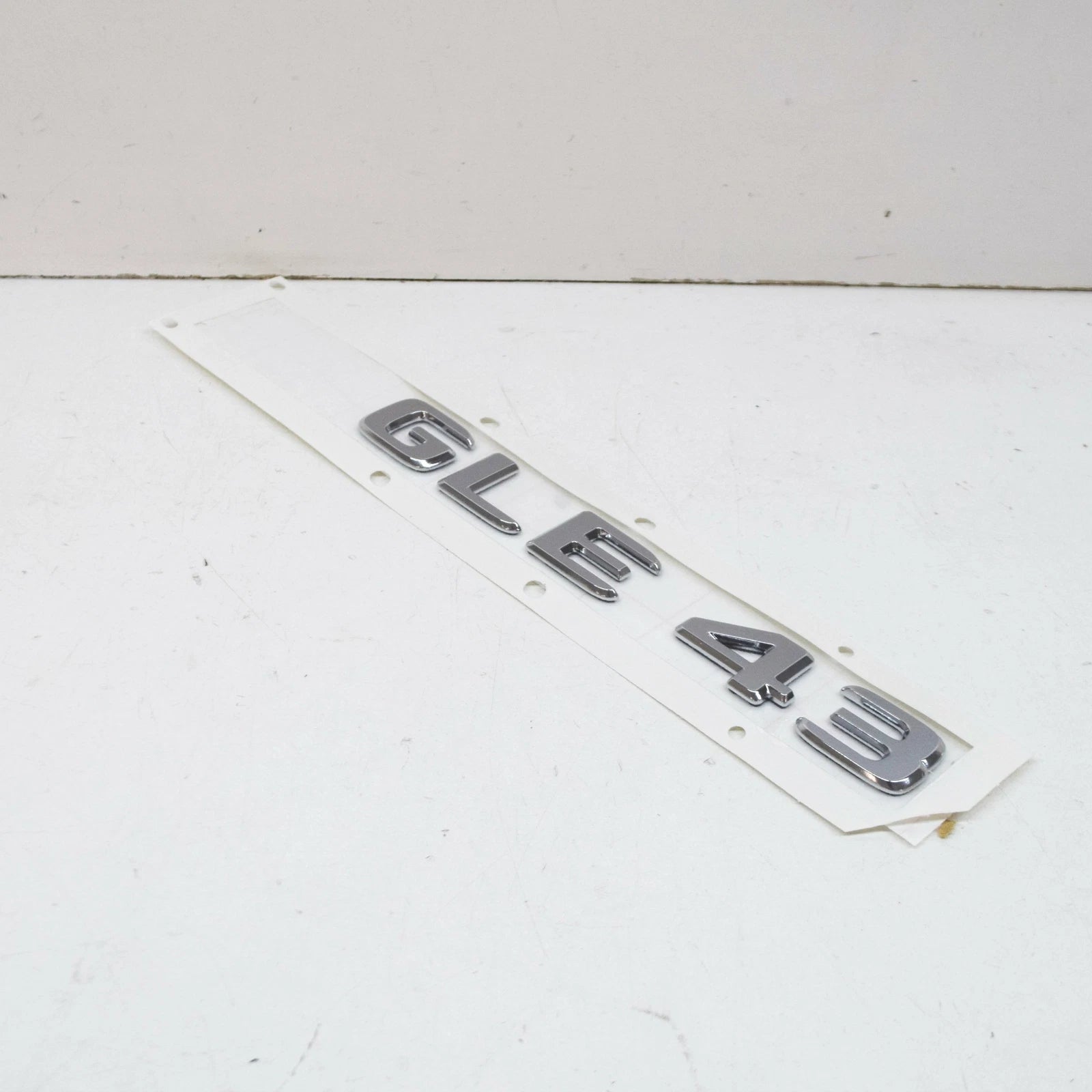 NEW MB GLE W166 REAR TRUNK BOOTLID EMBLEM BADGE A1668176400