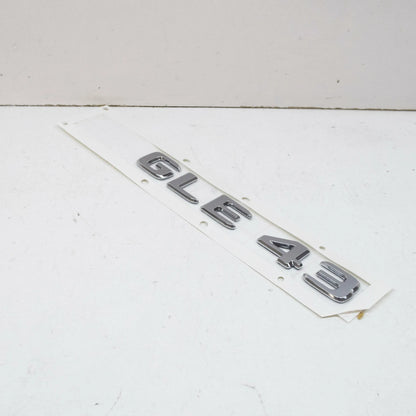 NEW MB GLE W166 REAR TRUNK BOOTLID EMBLEM BADGE A1668176400