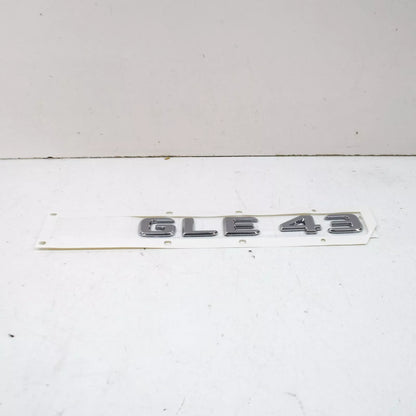 NEW MB GLE W166 REAR TRUNK BOOTLID EMBLEM BADGE A1668176400