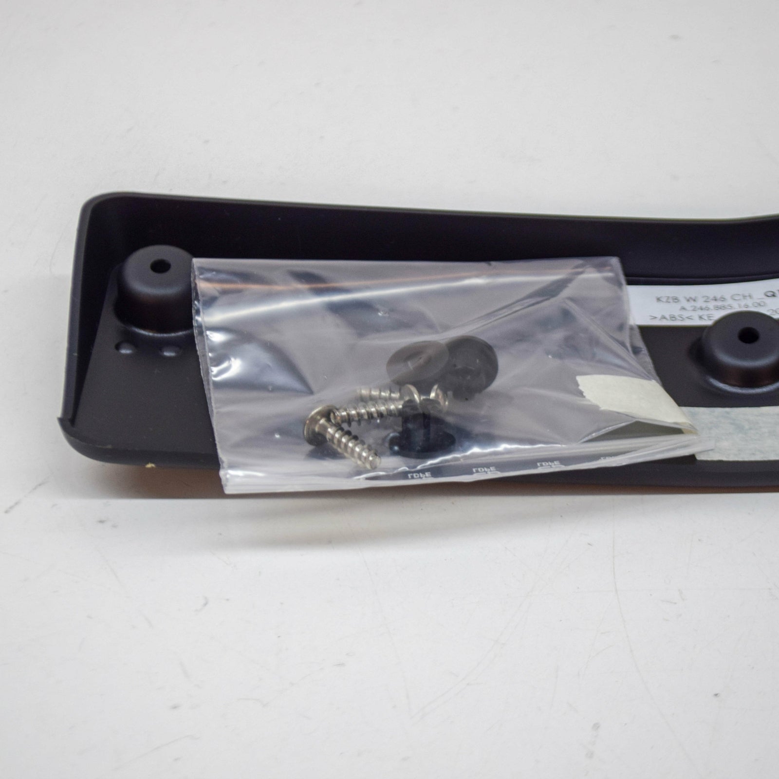NEW MERCEDES-BENZ B W246 FRONT BUMPER LICENSE PLATE MOLDING A2468801100 ORIGINAL