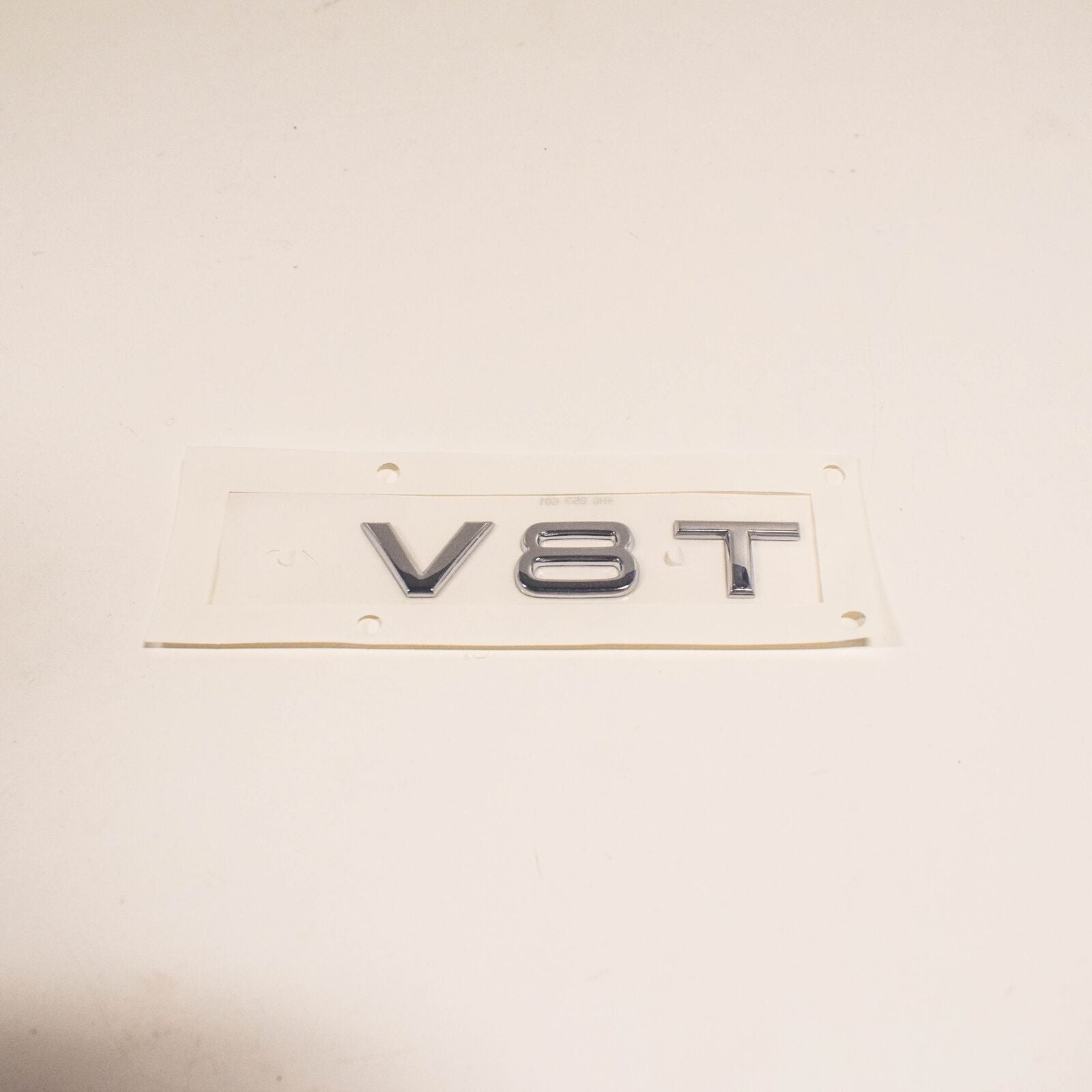 NEW AUDI A8 4H FRONT BUMPER SIDE EMBLEM INSCRIPTION BADGE 4H0853601 2ZZ ORIGINAL