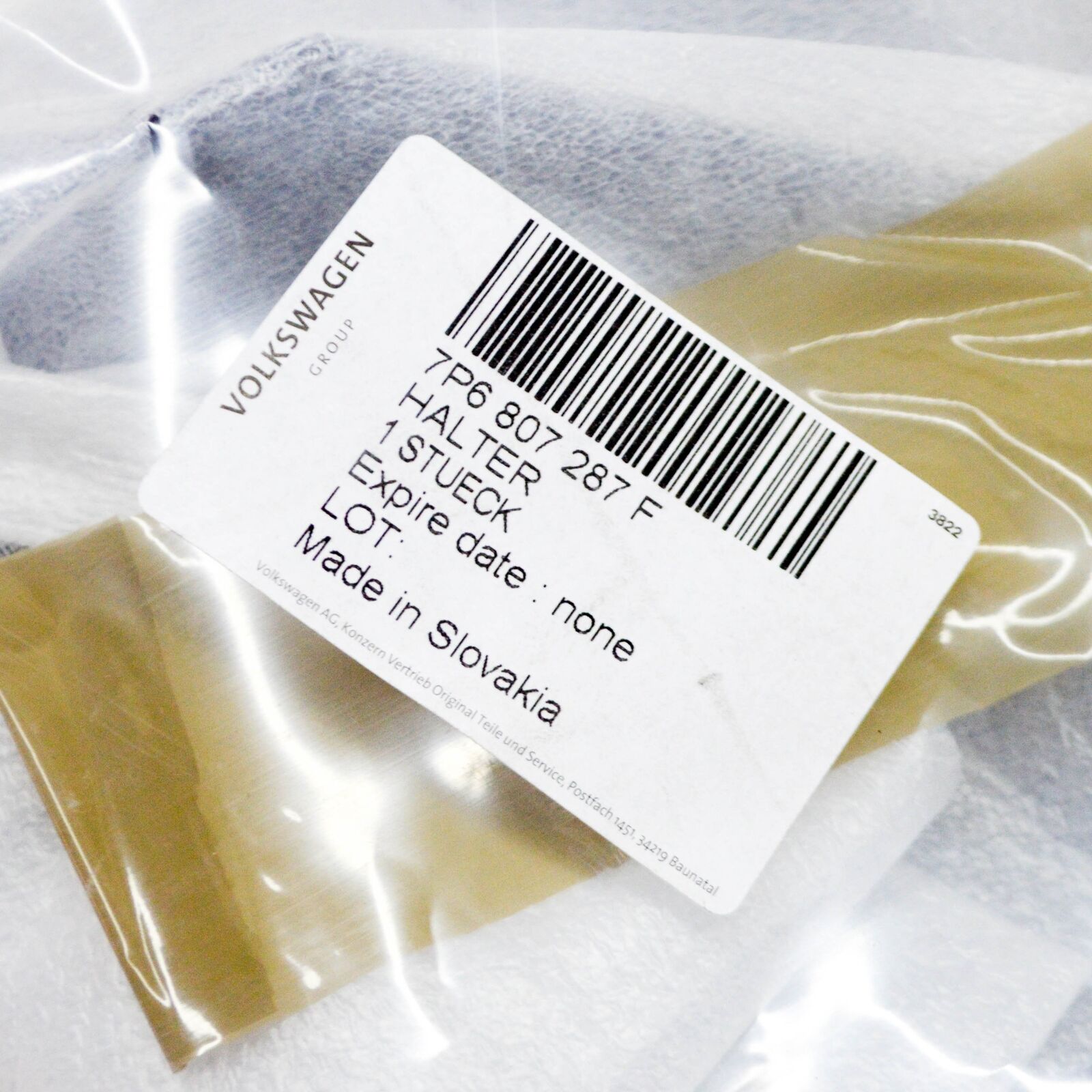 NEW VW TOUAREG 7P FRONT LICENSE PLATE HOLDER 7P6807287F ORIGINAL