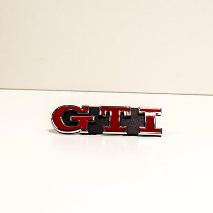 NEW VOLKSWAGEN GOLF MK7 GTI GRILL BADGE EMBLEM 5G0853679PWYR ORIGINAL